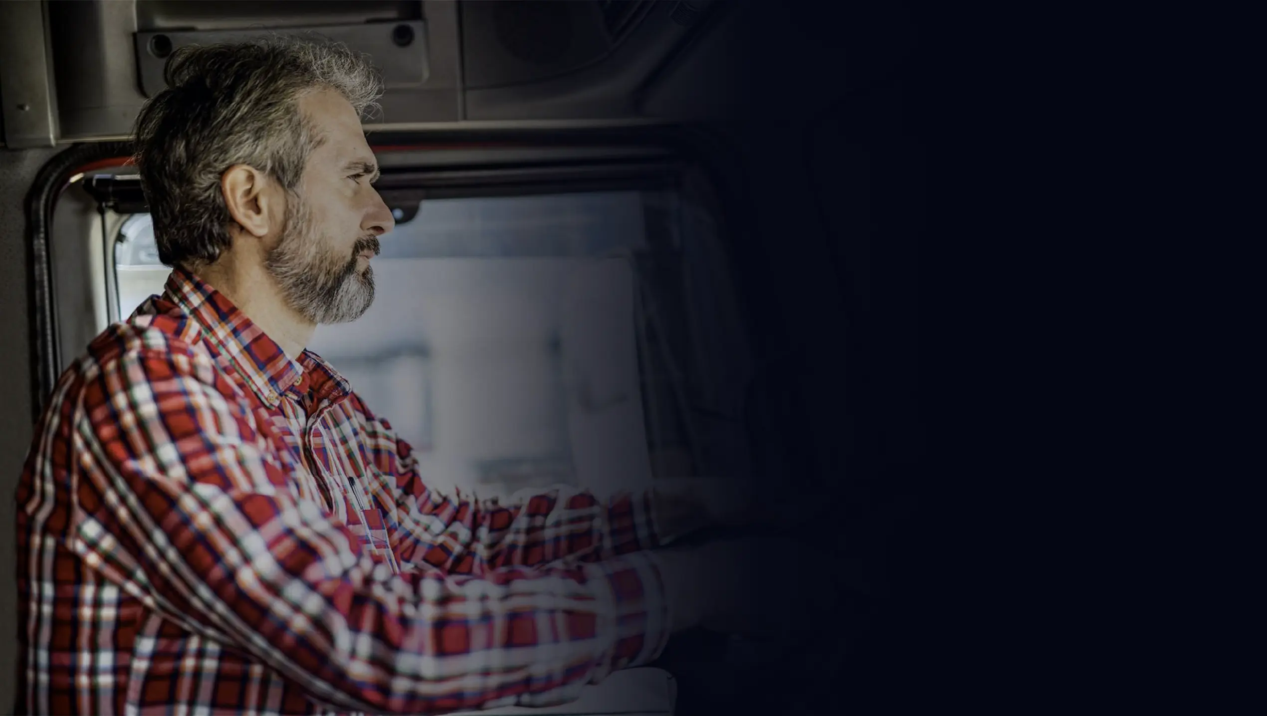 A man driving a bigrig